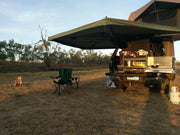 Camping vehicle with extended 30 Second Wing Awning and outdoor setup showcasing a second wing awning