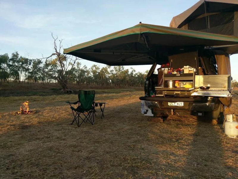 Camping vehicle with extended 30 Second Wing Awning and outdoor setup showcasing a second wing awning