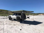 Off-road vehicle with 30 Second Wing Awning on sandy terrain showcasing the second wing awning