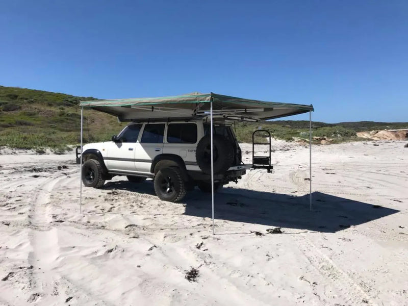 Off-road vehicle with 30 Second Wing Awning on sandy terrain showcasing the second wing awning