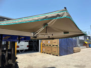 Retractable 30 Second Wing Awning extending over outdoor space for shade and comfort