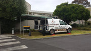 White van with Cardiac Hire Sport branding parked on street showcasing a wing awning