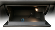 Alpine NaviStick with USB cable stashed inside a glovebox
