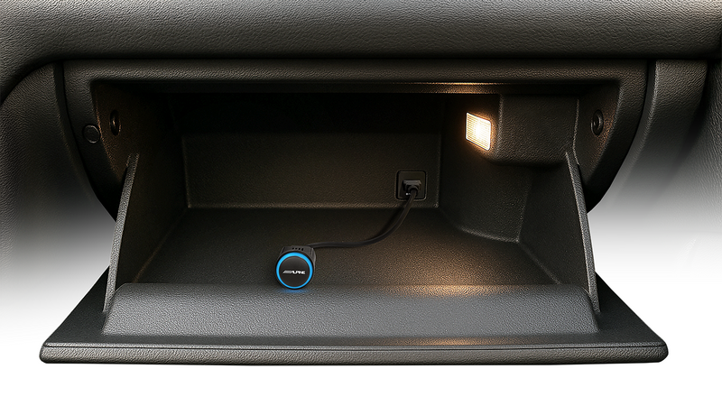 Alpine NaviStick with USB cable stashed inside a glovebox