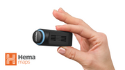 Alpine NaviStick Hema Nav module held in a hand next to the Hema Maps logo