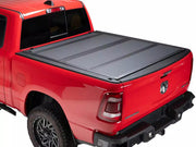 BAKFlip MX4 hard folding tonneau cover closed on a red RAM 1500, rear three-quarter view