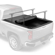 BAK Revolver X4TS hard rolling tonneau cover partly rolled back on a white Chevrolet Silverado
