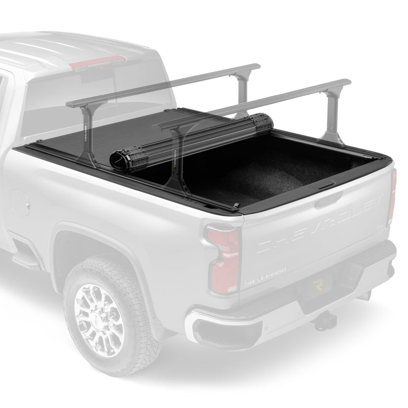 BAK Revolver X4TS hard rolling tonneau cover partly rolled back on a white Chevrolet Silverado