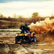 ATV rider kicking up dust on dirt trail with Carbon 3.0k 12V Trailer Quad Bike Electric Winch