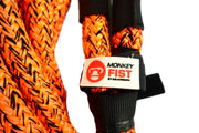 Bright orange braided carbon offroad kinetic recovery rope with Monkey Fist brand tag