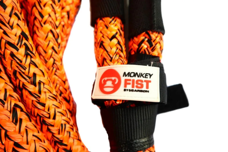 Bright orange braided carbon offroad kinetic recovery rope with Monkey Fist brand tag