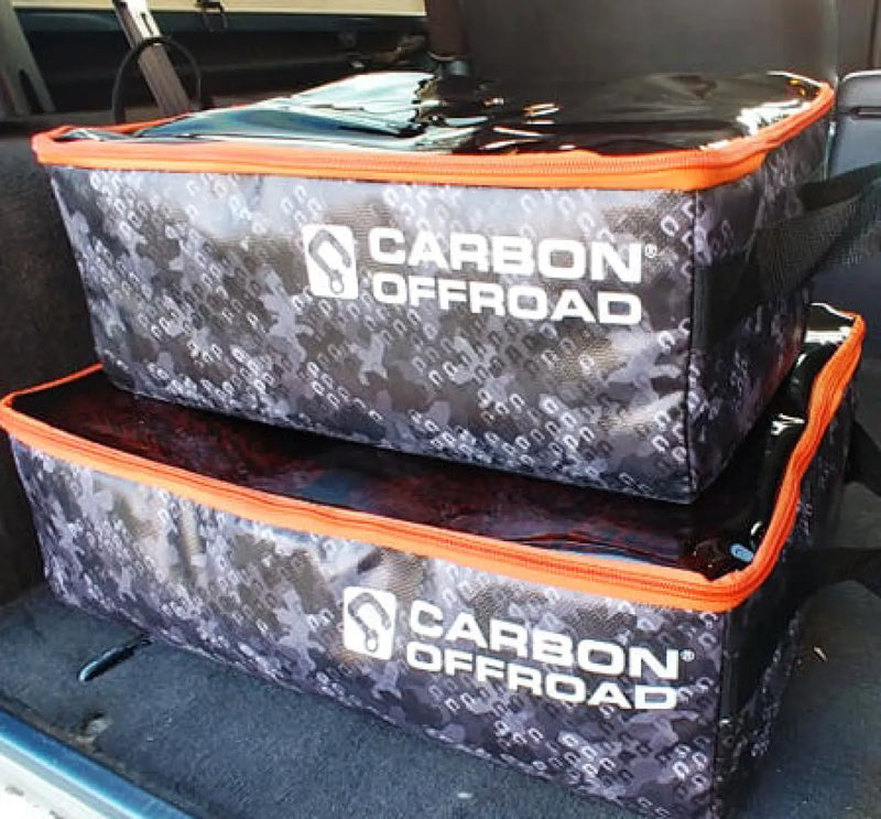 Carbon Offroad gear cube storage with camouflage pattern and orange trim on stacked containers