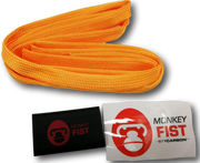 Bright orange monkey fist rope or safety rope coiled in a curved shape for offroad adventures