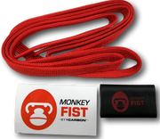 Red braided monkey fist rope coil for offroad adventure in a durable fist rope sheath