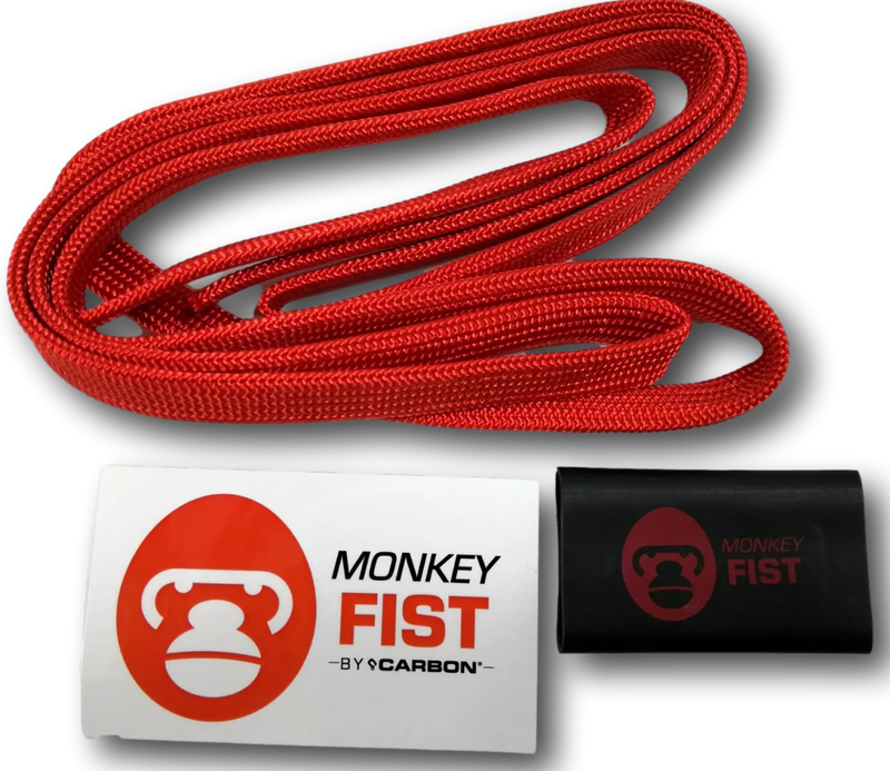 Red braided monkey fist rope coil for offroad adventure in a durable fist rope sheath