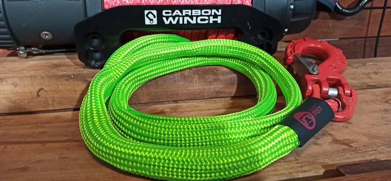 Bright green synthetic monkey fist rope with red hook attachment for offroad tow lines