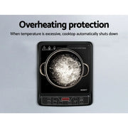 Devanti Electric Portable Induction Cooktop with a pot of boiling water on its surface