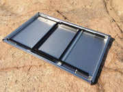 Folding solar panel with three sections on sandy ground for Eezi-Awn K9 Large Stainless Steel Camping Table