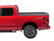 Red pickup truck with covered truck bed and 4x4 badging under the Extang Trifecta E-Series soft folding truck bed cover