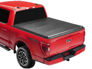 Red Ford pickup truck with Extang Trifecta E-Series soft folding truck bed cover