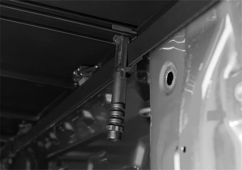 Sprinkler head protruding from ceiling above truck bed with Extang Trifecta E-Series soft folding truck cover