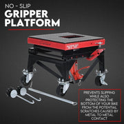 Red and black gripper platform with wheels on a dark background