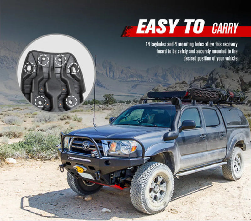 Silver Toyota Tacoma with off-road modifications and FieryRed 15T Recovery Boards