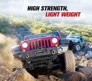 Red off-road Jeep with oversized tires climbing rocky terrain using Dyneema synthetic winch rope