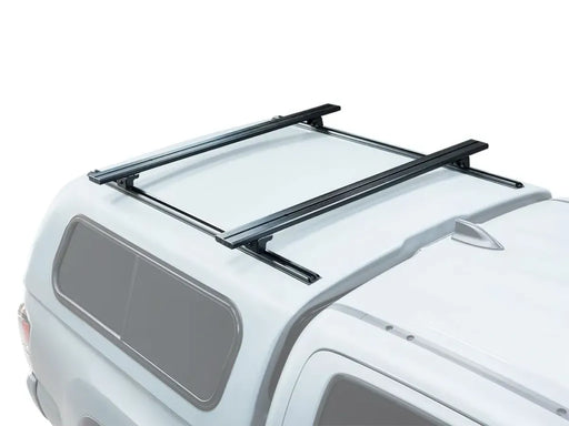 Roof rack load bar mounted on white truck canopy for Front Runner Load Bar Kit 1165mm