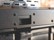 Close-up of black metal firearm receiver with screws, ideal for Front Runner Cargo Slide