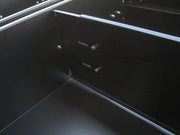 Sleek black car dashboard with Front Runner drawer dividers