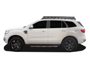 White SUV with roof rack kit and slimline II tray, dark wheels, Front Runner Ford Everest