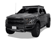 Ford F-150 Raptor with off-road modifications displaying Front Runner roof rack kit