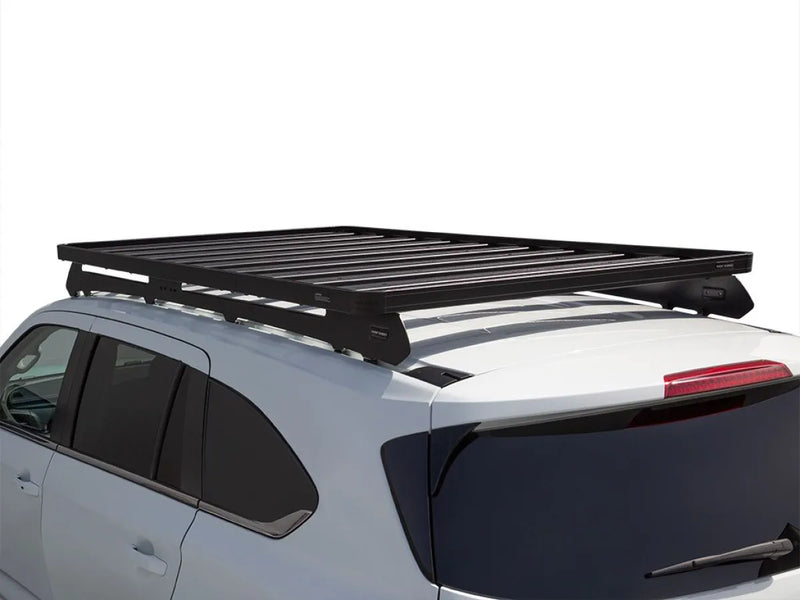 Black roof rack mounted on white SUV showcasing Front Runner Slimline II Roof Rack Kit