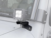 LED light bar mounted on Jeep Wrangler JK/JKU windshield spot light brackets