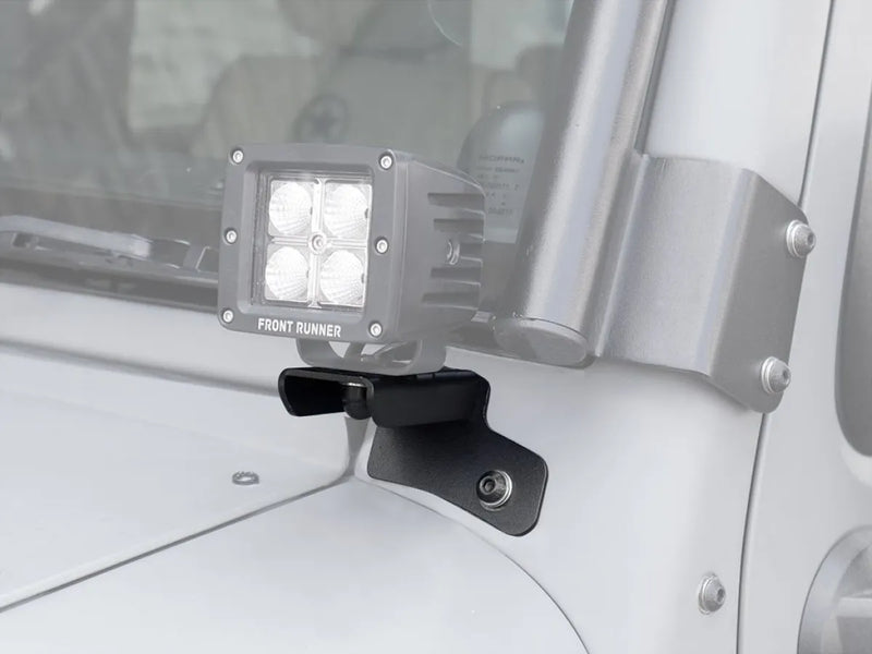 LED light bar mounted on Jeep Wrangler JK/JKU windshield spot light brackets