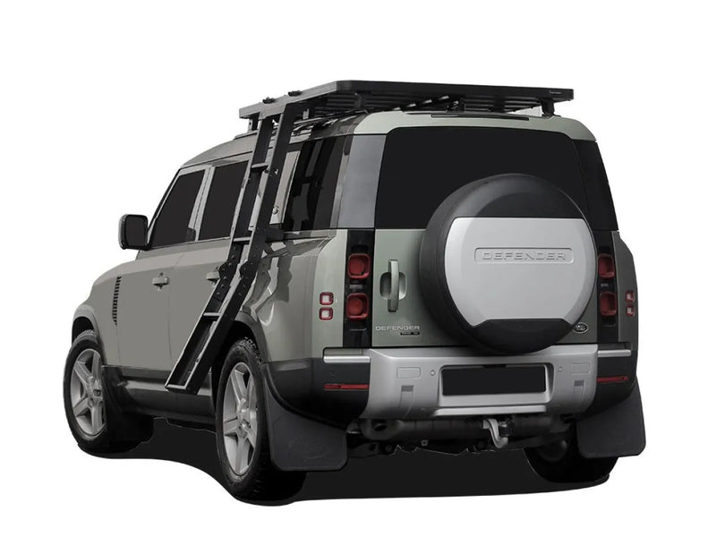 Land Rover Defender SUV with roof rack and ladder for off-road adventures