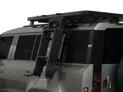 SUV with roof rack installed on Land Rover Defender for added cargo space
