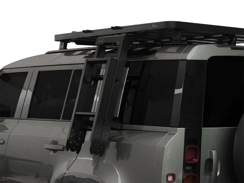 SUV with roof rack installed on Land Rover Defender for added cargo space
