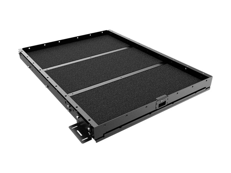 Sliding drawer cargo slide with textured black surface and metal edges for load bed cargo