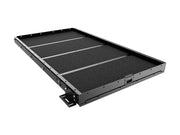 Sliding cargo slide for load bed cargo management with textured black surface and metal frame