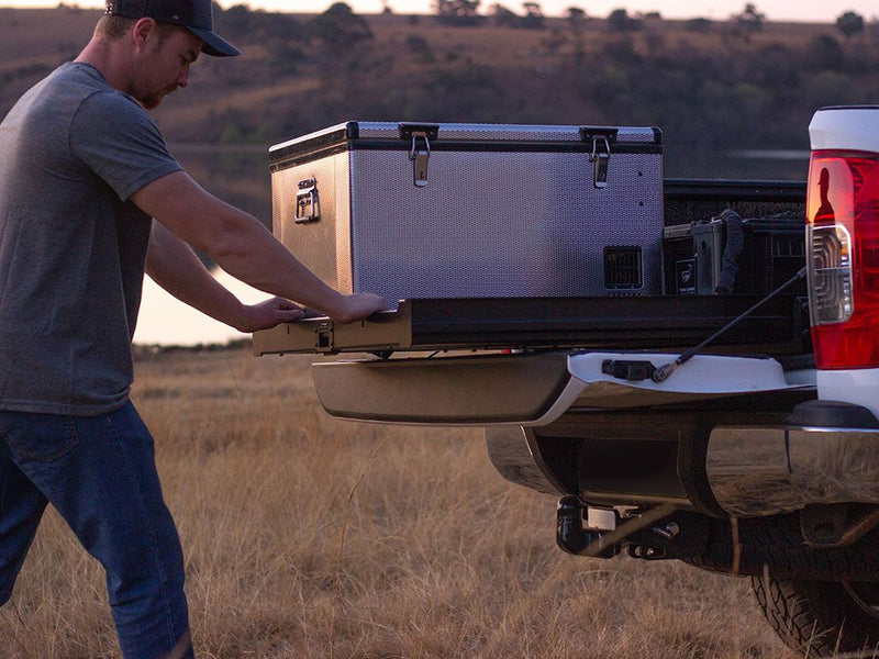 Portable refrigerator on Front Runner Load Bed Cargo Slide in a truck load bed cargo area