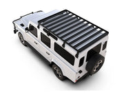 White SUV with black roof rack from Front Runner LR Defender 110 Slimline II roof rack kit