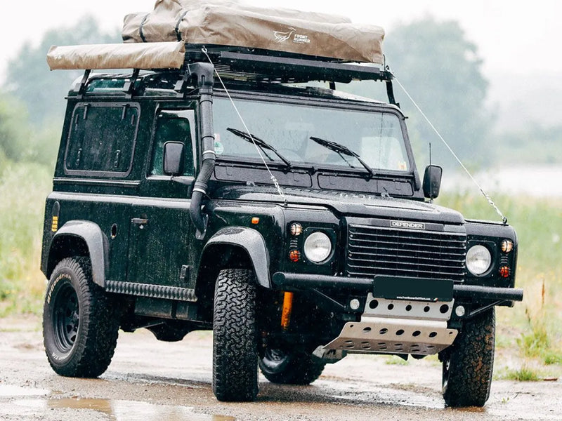 Rugged Land Rover Defender with Front Runner LR Defender 90 Slimline II roof rack kit for off-road adventures
