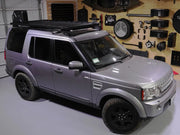 Silver Land Rover Discovery SUV with Front Runner LR Discovery LR3 LR4 Slimline II roof rack kit