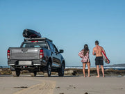 Pickup truck on beach with Front Runner Mazda BT50 Slimline II roof rack kit