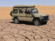 Off-road vehicle with roof rack kit parked on cracked dry earth for Gelandewagen G Class
