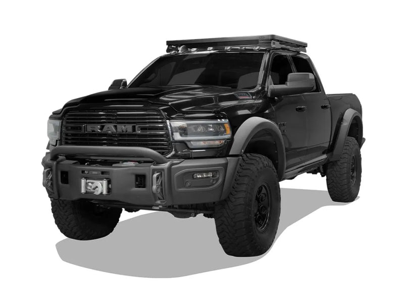 Black RAM pickup truck with off-road modifications featuring a Front Runner roof rack kit