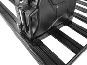 Front Runner Single Jerry Can Holder mounted on roof rack with stainless steel black powder coated finish
