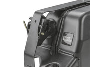 Close-up of a car’s headlight assembly on Front Runner Single Jerry Can Holder stainless steel black powder coated